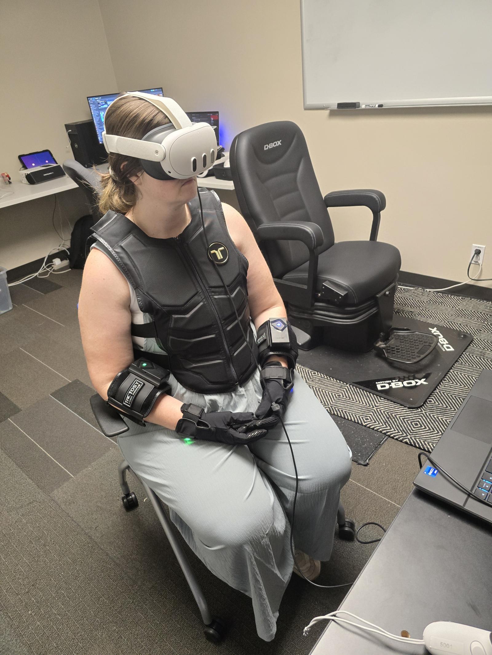 Woman wearing a bhaptics vest