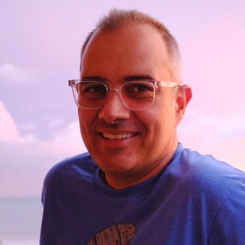 Man in glasses and blue shirt