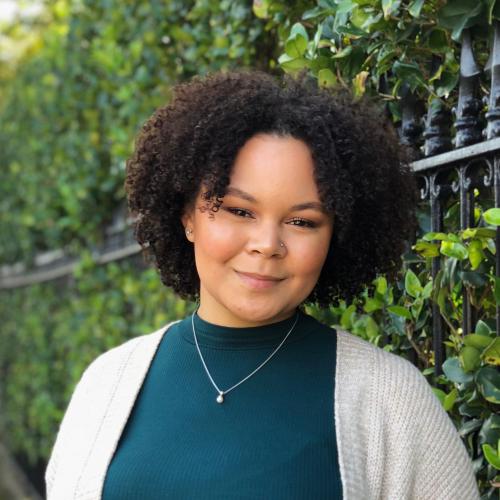 head shot of woman with curly hair
